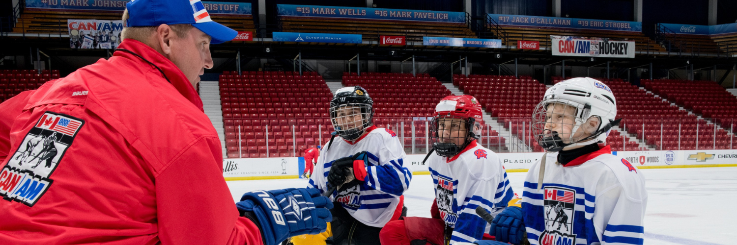 Coach kneeling with campers